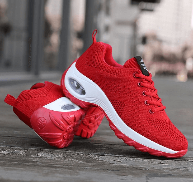 Bright red women's breathable sneakers with mesh upper, EVA insole, and non-slip sole for outdoor sports.